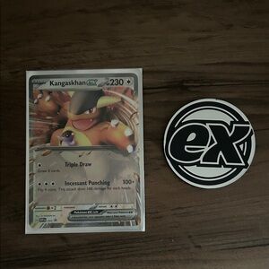 Kangaskhan EX Pokémon Card and coin